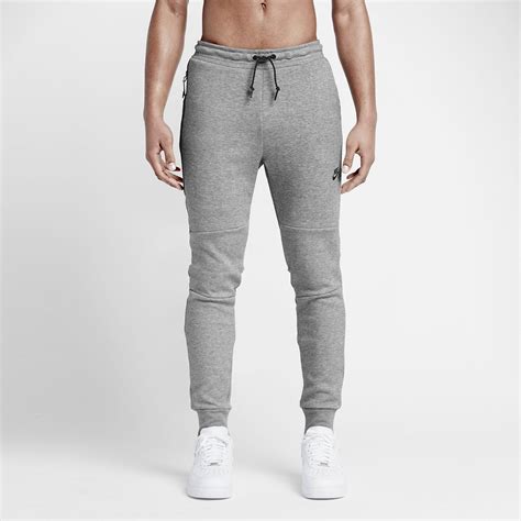 dark grey Nike tech pants